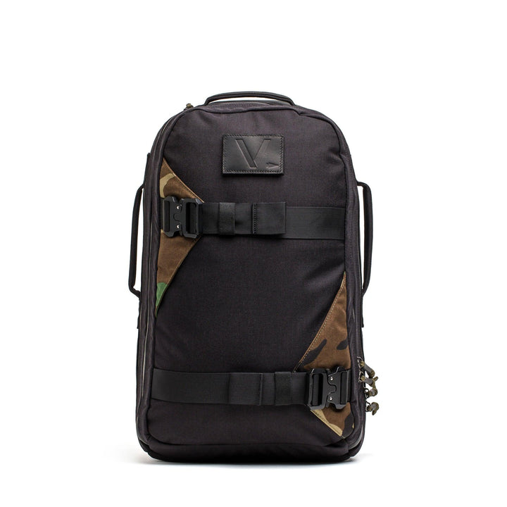 GORUCK black backpack with woodland camo accents and sturdy buckles, front view