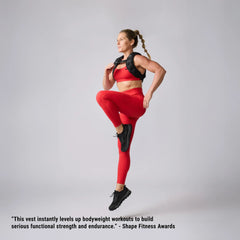 Woman in red workout gear performing high knee exercise wearing black GORUCK training vest.