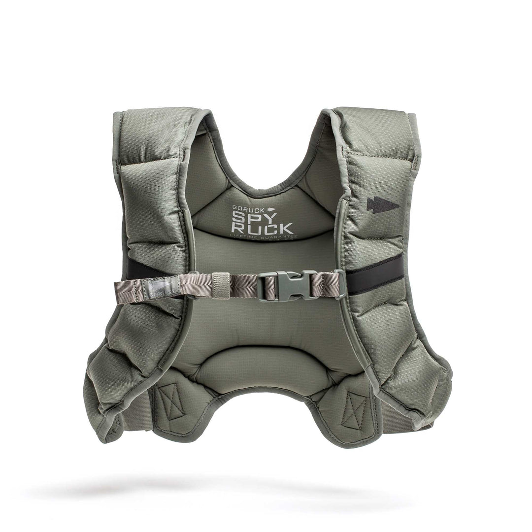 The Spy Ruck | Women's Weighted Vest by GORUCK is an olive green padded vest with chest buckle and "GORUCK Ruck Vest" logo, designed as a stylish weighted vest for women.