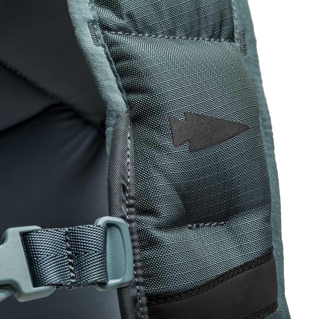 Closeup of GORUCK rucksack shoulder strap with arrowhead patch and durable stitching