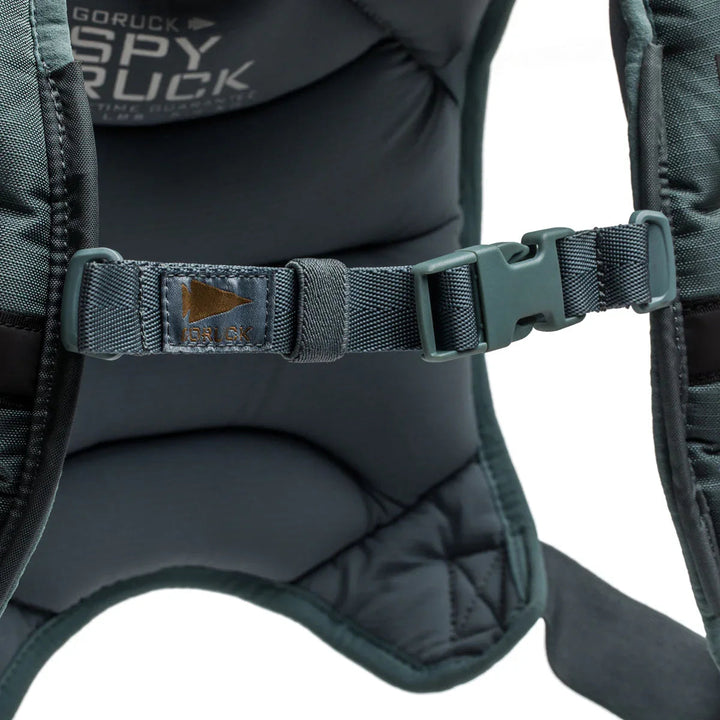 GORUCK SPY Ruck backpack padded straps with buckle and logo detail, close-up view