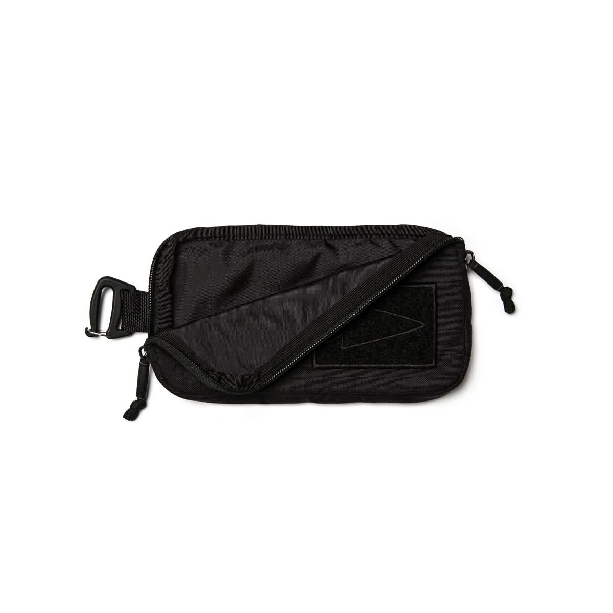 GORUCK black sternum strap pouch with zipper and attachment clip on white background