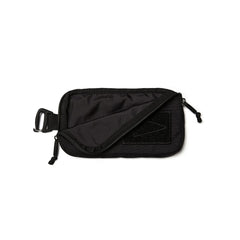 GORUCK black sternum strap pouch with zipper and attachment clip on white background