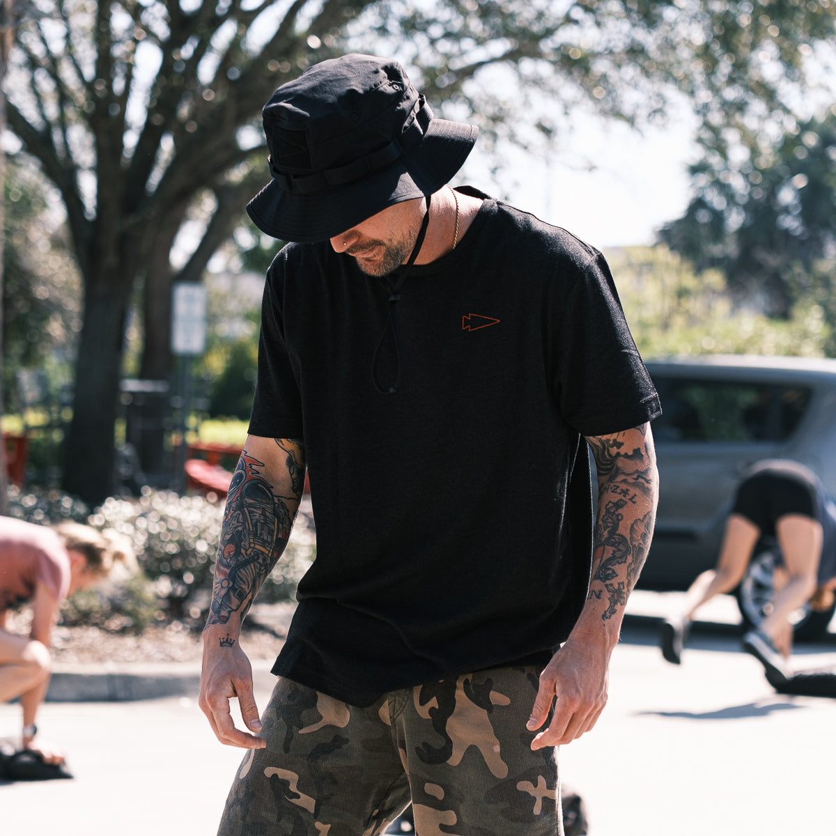 GORUCK black Subtle Spearhead tee, camo shorts, outdoor fitness street scene
