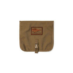 The GORUCK Wire Dopp is a brown pouch with a flap, buckle closure, and front spear logo patch—ideal for organizing your travel essentials or EDC gear.
