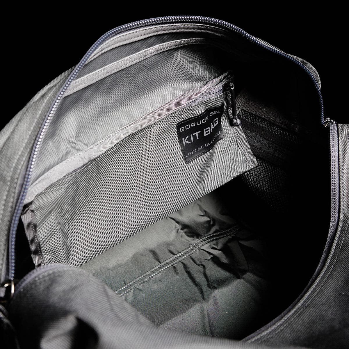 Open the gray Kit Bag from GORUCK, featuring a visible inner pocket and a label that reads 