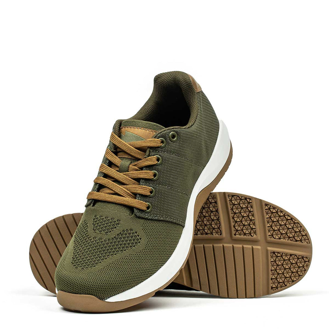 The GORUCK Ballistic Trainers in Green + White + Gum feature durable CORDURA® Ballistic Nylon, brown soles, and tan laces—athletic sneakers designed for reliability, shown on a white background.