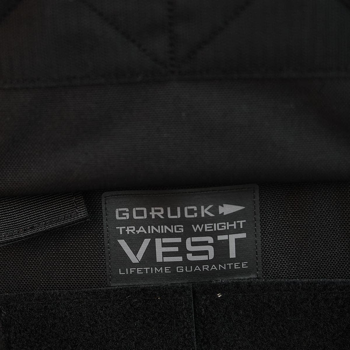 Close-up of a GORUCK Training Weight Vest 2.0 label highlighting the prominent 