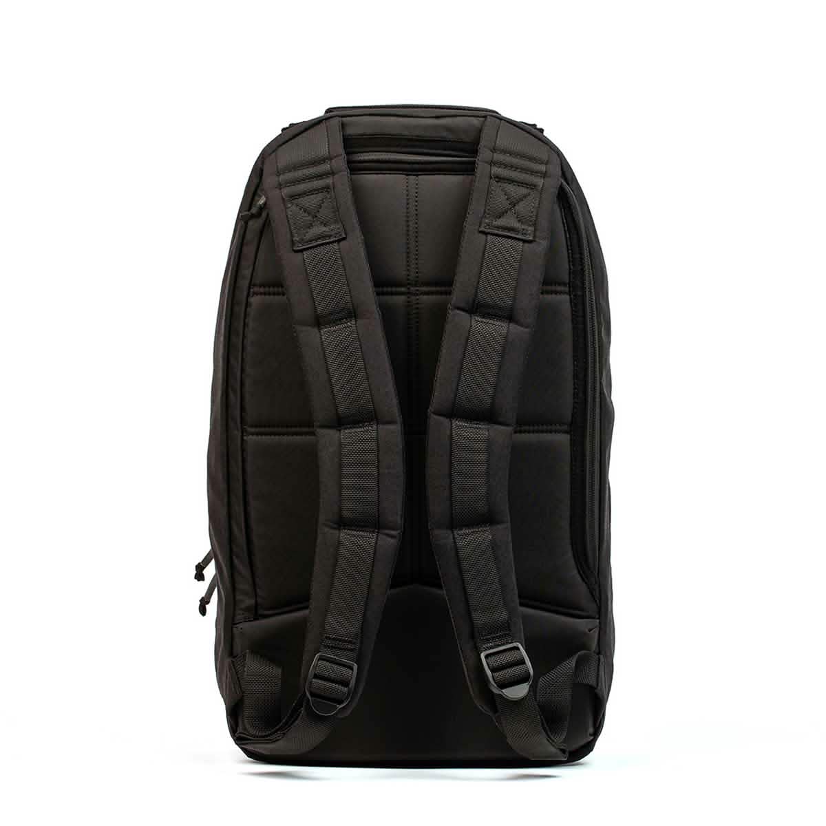 The GORUCK Bullet Ruck Laptop - Ballistic Nylon Cordura is shown from the back, featuring padded shoulder straps and quilted padding—a durable daypack with a bombproof laptop compartment for secure everyday carry.