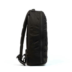 Side view of the GORUCK Bullet Ruck Laptop - Ballistic Nylon Cordura, showcasing a top handle, zip closure, padded straps, and a bombproof laptop compartment—perfect for everyday carry.
