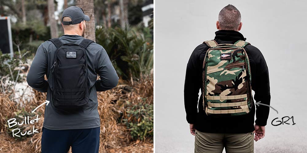 Two men seen from behind wearing backpacks; one black labeled 