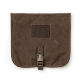 The GORUCK Wire Dopp - Waxed Canvas is a brown, square pouch featuring a buckle closure and arrowhead patch—ideal for EDC organization or securing your travel essentials.