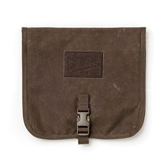 The GORUCK Wire Dopp - Waxed Canvas is a brown, square pouch featuring a buckle closure and arrowhead patch—ideal for EDC organization or securing your travel essentials.