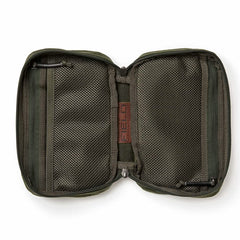 The GORUCK GR1 Field Pocket - Waxed Canvas is shown open and lying flat on a white background, revealing mesh zippered pockets on both sides—echoing the durable organization and classic styling of heritage field gear.
