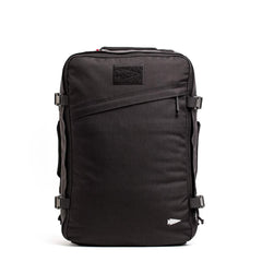 The GORUCK GR3 - Cordura is a black travel backpack with side buckles, top handle, slanted front zipper pocket, and waterproof zippers, designed as a carry-on rucksack. Shown on a white background.