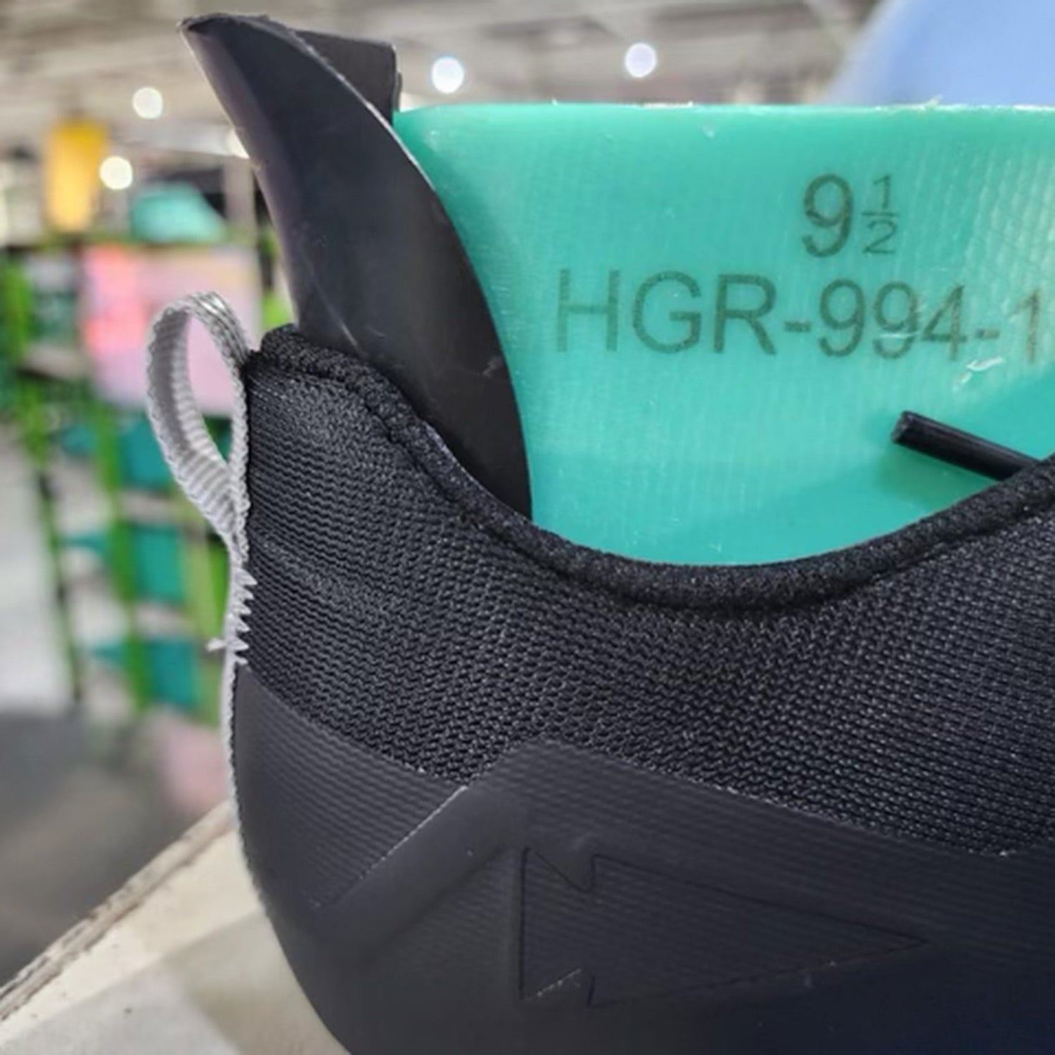 Close-up of a green shoe last marked 