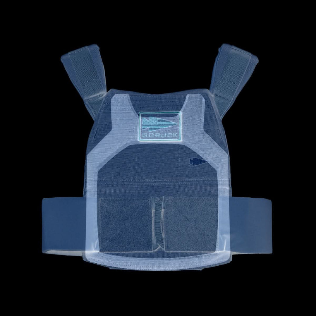 The Rucking Weight Vest is navy blue with shoulder straps for rucking and features a visible GORUCK logo on the chest.