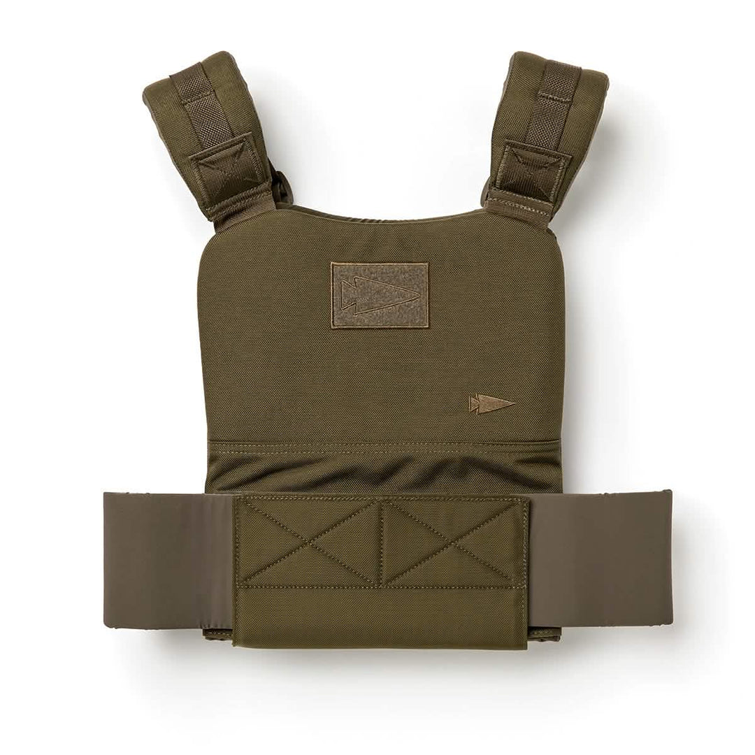 The GORUCK Training Weight Vest 2.0 is a green tactical vest featuring padded shoulder straps and a front Velcro patch, designed for versatile training as an adjustable weighted vest.