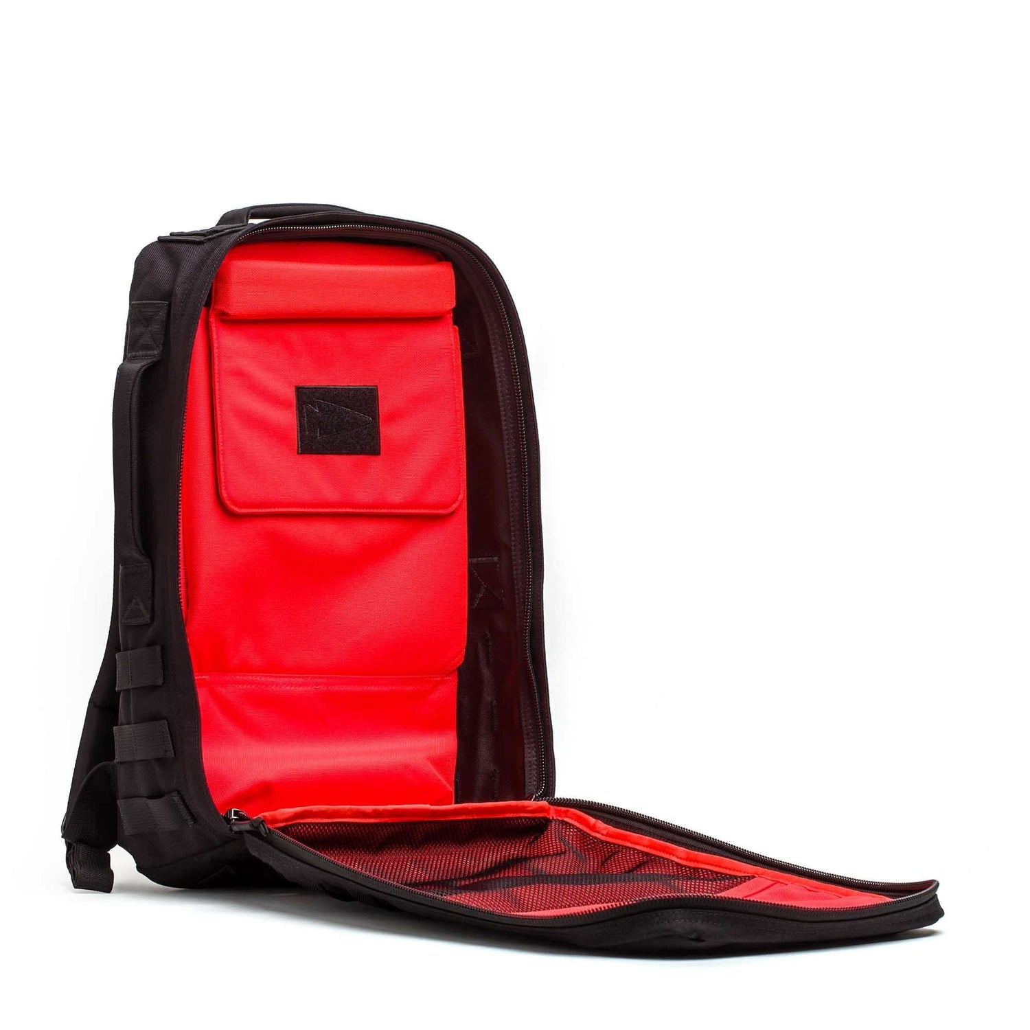 The Rucker 5.0 backpack features a front opening that reveals a bright red interior and multiple compartments, making it ideal for rucking or daily use.