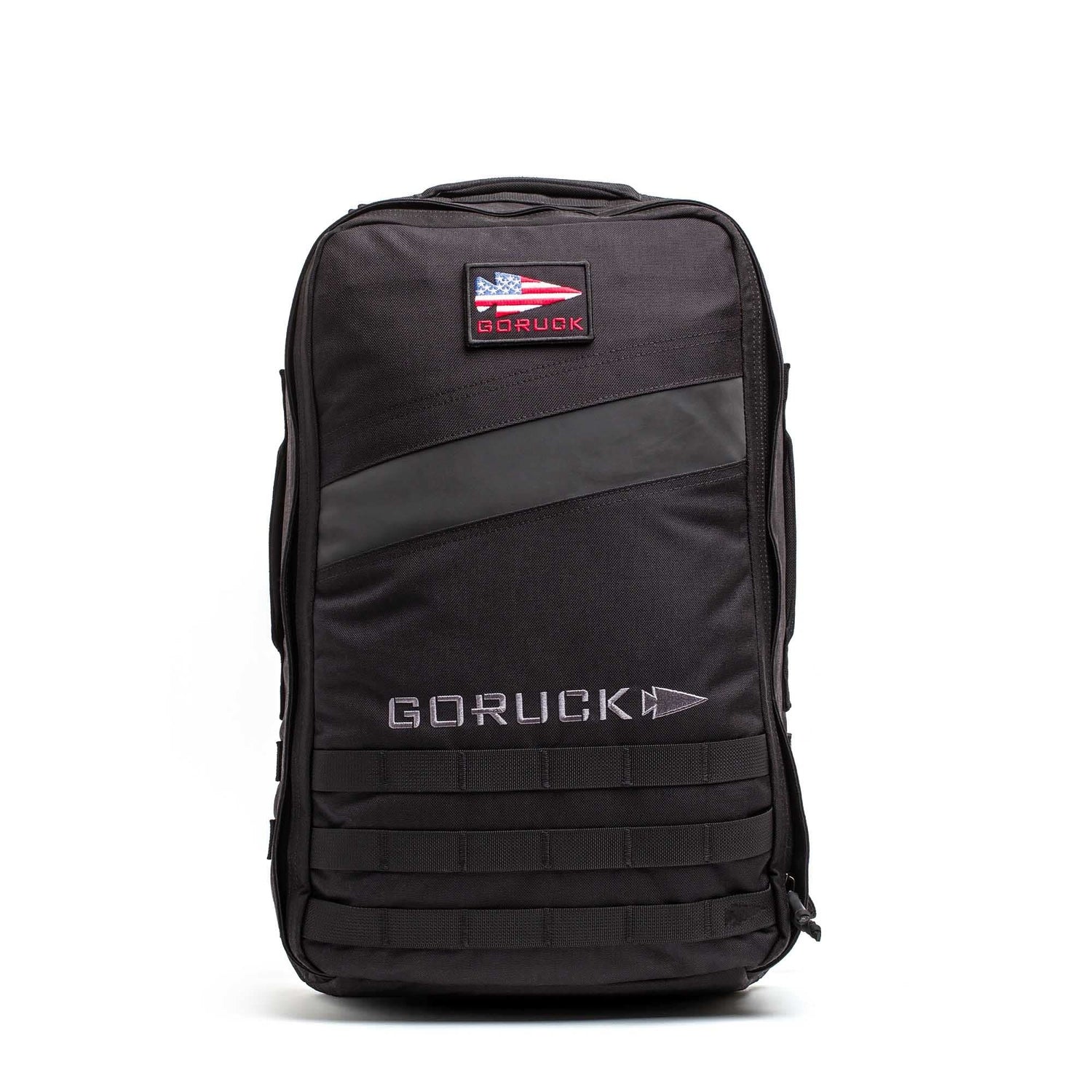 The Rucker 5.0 is a black GORUCK rucksack with a patch and MOLLE webbing on the front, designed for rucking and carrying ruck plates, shown against a white background.