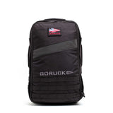 The Rucker 5.0 is a black GORUCK rucksack with a patch and MOLLE webbing on the front, designed for rucking and carrying ruck plates, shown against a white background.