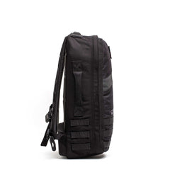 The Rucker 5.0, shown from the side against a white background, features multiple straps and a top handle—ideal for rucking or everyday use.