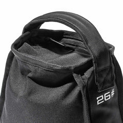 Close-up of a black fabric bag with a handle, featuring "2G#" embroidered in white on the front, crafted by GORUCK with durability in mind for their Sand Kettlebells collection.