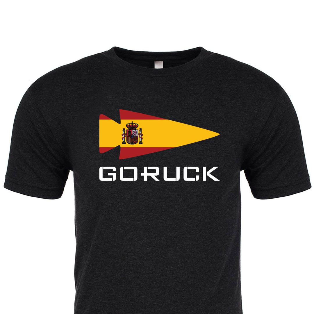 The T-shirt - Rep Your Country by GORUCK EU features "GORUCK" text and a flag design incorporating the Spanish coat of arms, crafted from premium tri-blend fabric.