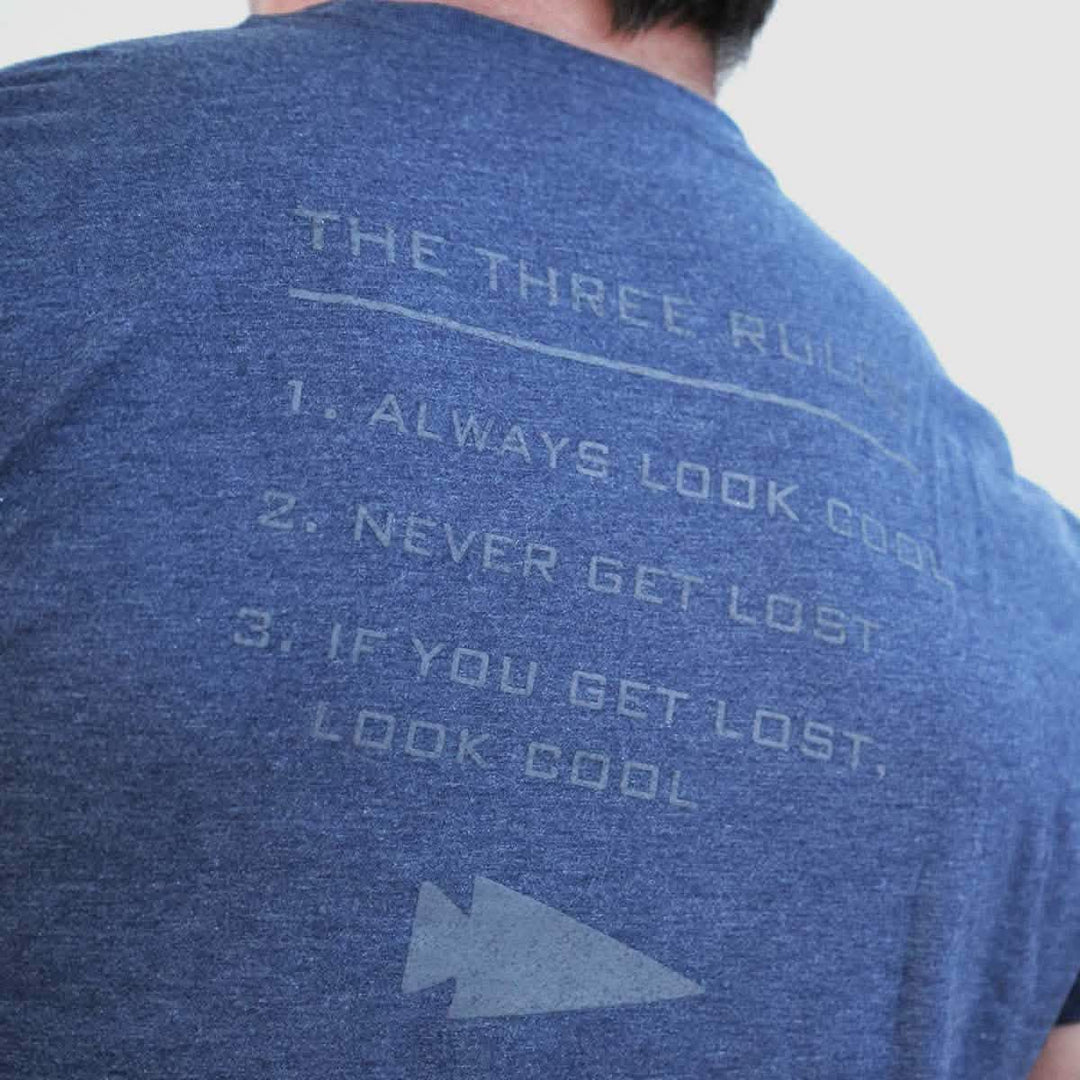 The Three Rules Tee - Tri-Blend by vendor-unknown features "THE THREE RULES: 1. ALWAYS LOOK COOL 2. NEVER GET LOST 3. IF YOU GET LOST, LOOK COOL." on the back—a must-have for anyone who loves cool photos or wants to stand out.