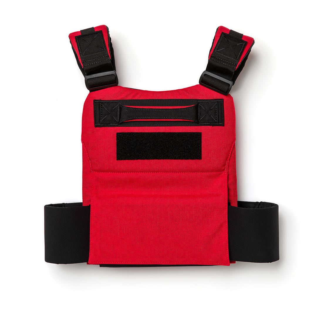 The Training Weight Vest 2.0 by GORUCK is a red tactical vest featuring black straps, specifically designed for training and equipped with a front Velcro patch.